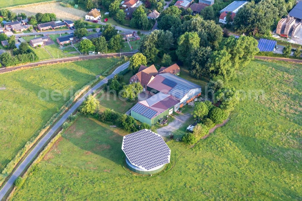 Aerial image Süderdeich - Turnable Solar power plant and photovoltaic systems on a roof in Suederdeich in the state Schleswig-Holstein, Germany