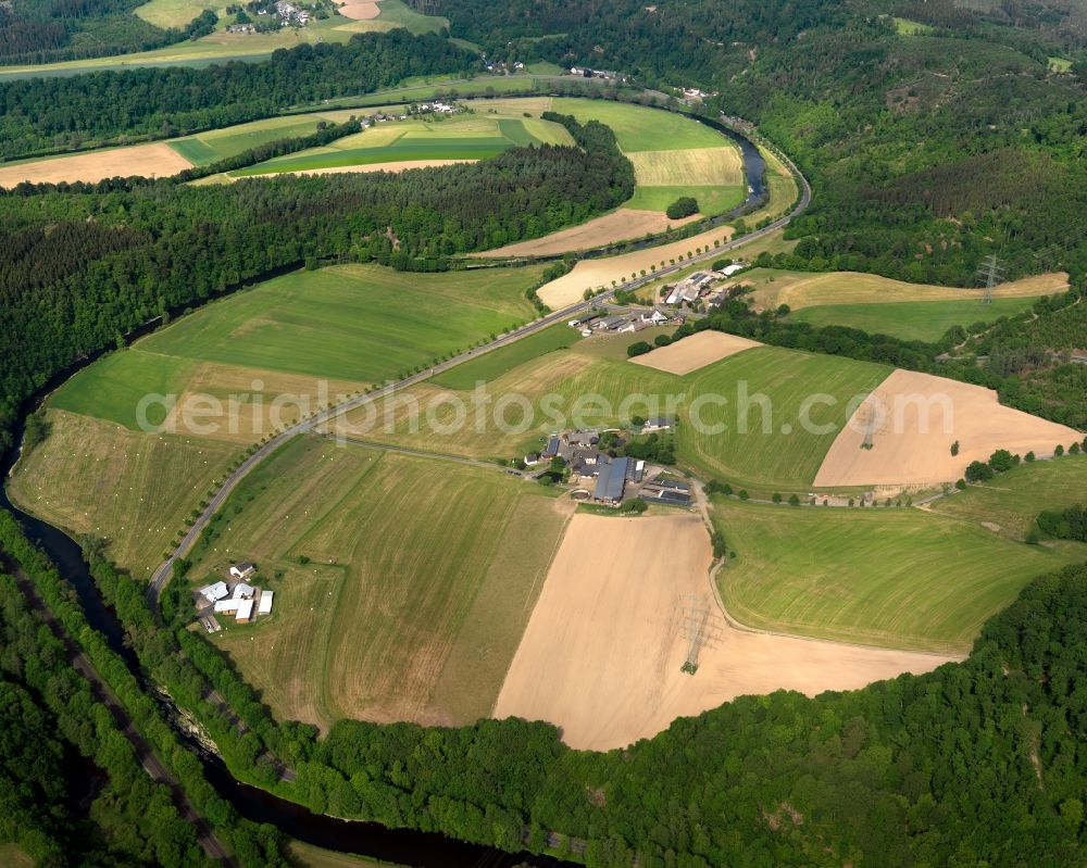 Hövels from above - Three agricultural estates on the river Sieg in Hoevels in the state of Rhineland-Palatinate. The three large farms are located on a small hill in a bend of the river Sieg. They belong to the municipiality of Hoevels which is located in the West