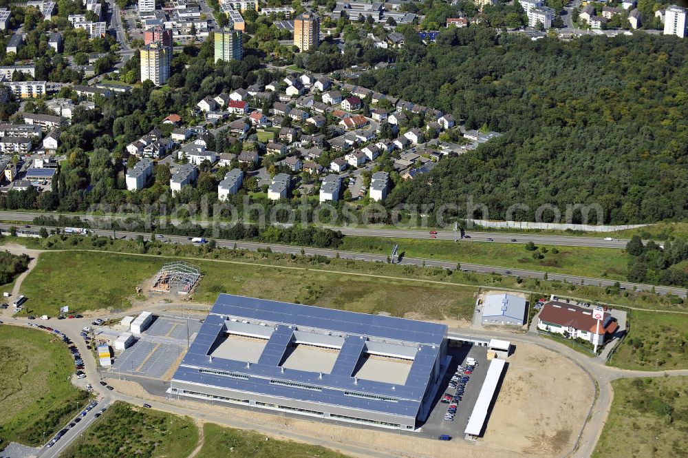 Rüsselsheim from the bird's eye view: Druckzentrum Rhein-Main GmbH & Co.KG im Gewerbepark / Business Park Blauer See am Verkehrsknotenpunkt Rüsselsheimer Dreieck im Rhein-Main-Gebiet. Das Büro- und Dienstleistungszentrum ist ein Projekt der HVB Immobilien AG. The industrial park Blauer See in the Rhine-Main region.