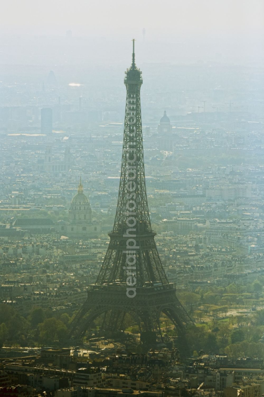 Paris from above - Haze and smog weather conditions at the Eiffel Tower Eiffel Tour the landmark in Paris in Ile-de-France, France