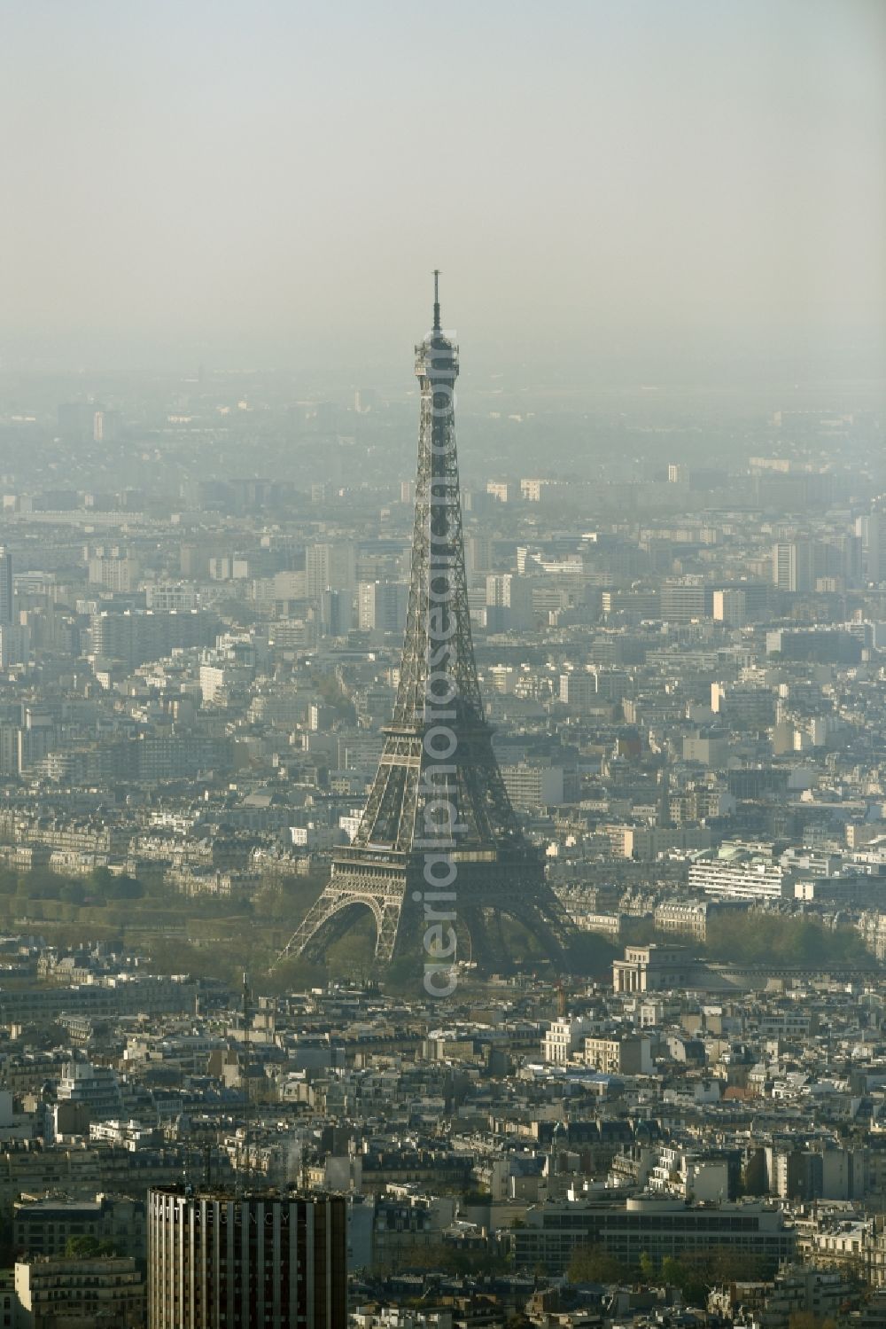 Paris from the bird's eye view: Haze and smog weather conditions at the Eiffel Tower Eiffel Tour the landmark in Paris in Ile-de-France, France