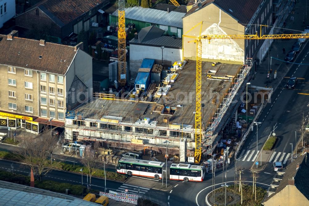 Herne from above - Construction site for the new residential and commercial Corner house - building on Bahnhofplatz corner Bahnhofstrasse in Herne in the state North Rhine-Westphalia, Germany