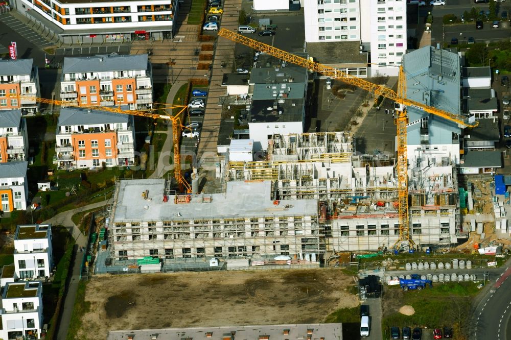 Aerial photograph Heusenstamm - Construction site for the new residential and commercial Corner house - building on Leibnitzstrasse in Heusenstamm in the state Hesse, Germany