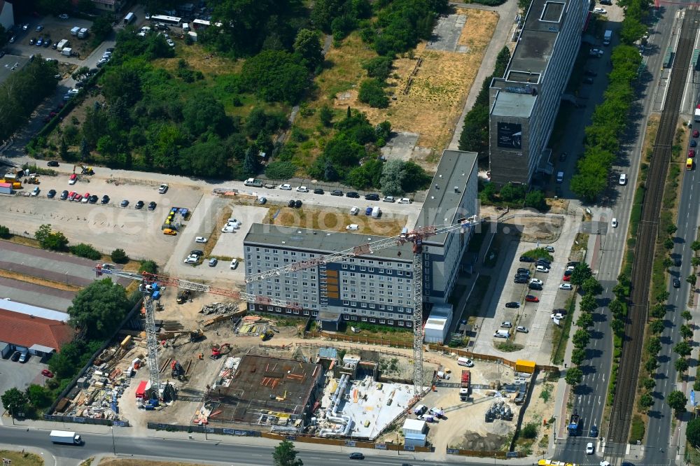 Aerial image Berlin - Construction site for the new residential and commercial Corner house - building on Marzahner Chaussee Ecke Allee of Kosmonauten in the district Marzahn in Berlin, Germany