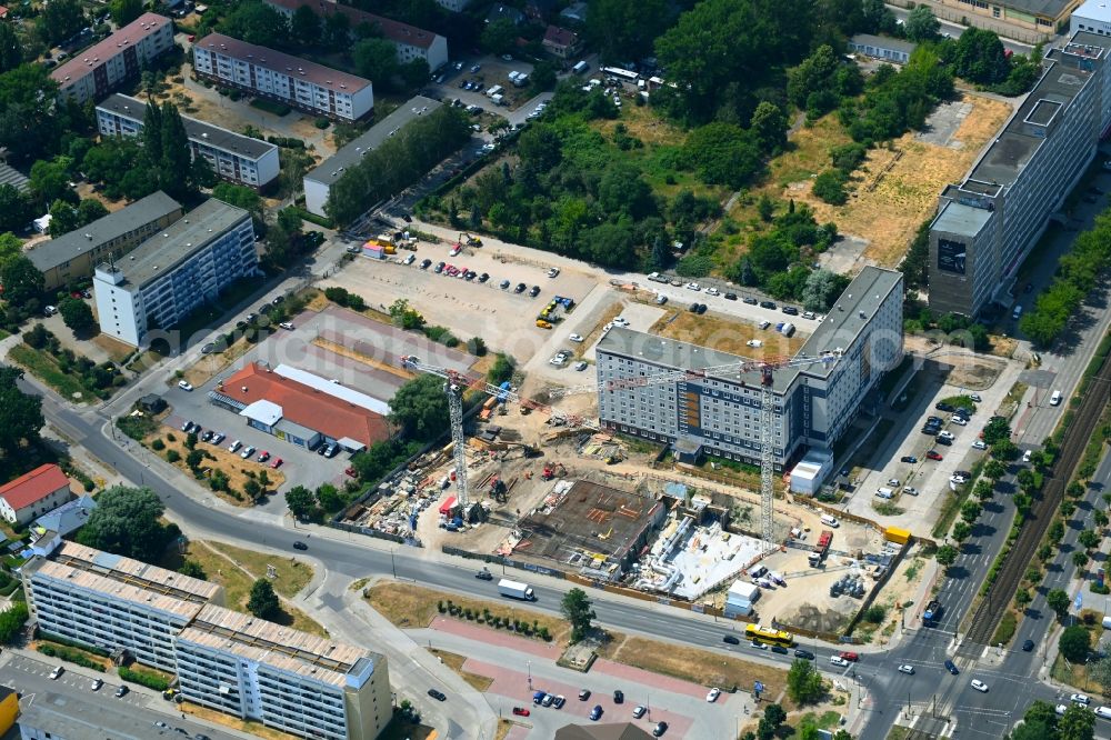 Aerial photograph Berlin - Construction site for the new residential and commercial Corner house - building on Marzahner Chaussee Ecke Allee of Kosmonauten in the district Marzahn in Berlin, Germany
