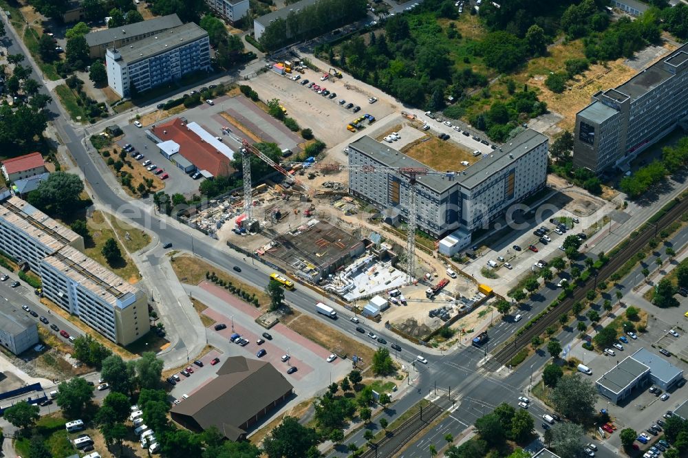 Berlin from above - Construction site for the new residential and commercial Corner house - building on Marzahner Chaussee Ecke Allee of Kosmonauten in the district Marzahn in Berlin, Germany