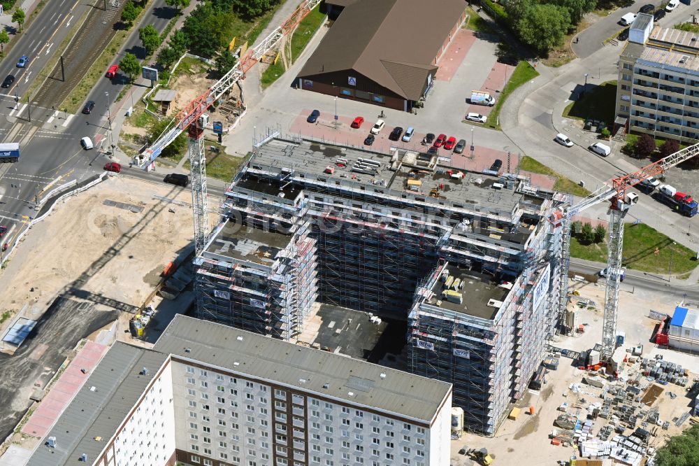 Berlin from the bird's eye view: Construction site for the new residential and commercial Corner house - building on Marzahner Chaussee Ecke Allee of Kosmonauten in the district Marzahn in Berlin, Germany