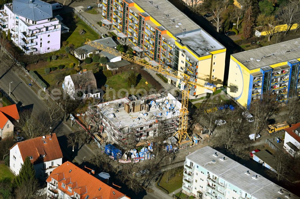 Berlin from the bird's eye view: Construction site for the new residential and commercial Corner house - building on street Schillerstrasse - Mozartstrasse in the district Wilhelmsruh in Berlin, Germany