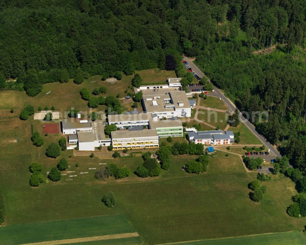 Bruchweiler from above - Edelsteinklinik rehab centre in the state of Rhineland-Palatinate. The borough and municipiality is an official spa resort and located in the county district of Birkenfeld, in the Hunsrueck region. It is surrounded by agricultural land, meadows and forest. A clinic for youth and children rehab is located outside the core of the village