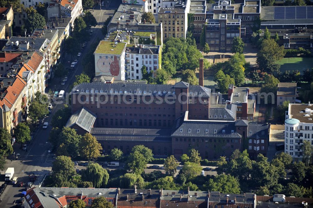 Berlin from the bird's eye view: Blick auf das ehemalige Umspannwerk, am Paul-Lincke-Ufer, in Berlin- Kreuzberg. Das Umspannwerk der Bewag wurde von 1926 bis 1928 nach den Entwürfen von Architekt Hans Heinrich Müller erbaut. 1984 wurde das denkmalgeschützte Gebäude stillgelegt. Der Turm verlieh dem Gebäude den Beinamen Kathedrale der Elektrizität. Seit der Sanierung 2002, wird das Gebäude vielseitig kulturell genutzt. View of the old substation, at the Paul-Lincke-Ufer in Berlin-Kreuzberg. The substaion was built from 1926 to 1928 according to disigns by architect Hans Heinrich Müller. The work was part of Bewag. In 1984 the listedt building was closed. The tower gave the building the nickname Cathedral of electricity. Since the restoration of 2002, the building is used in many ways versatilely.