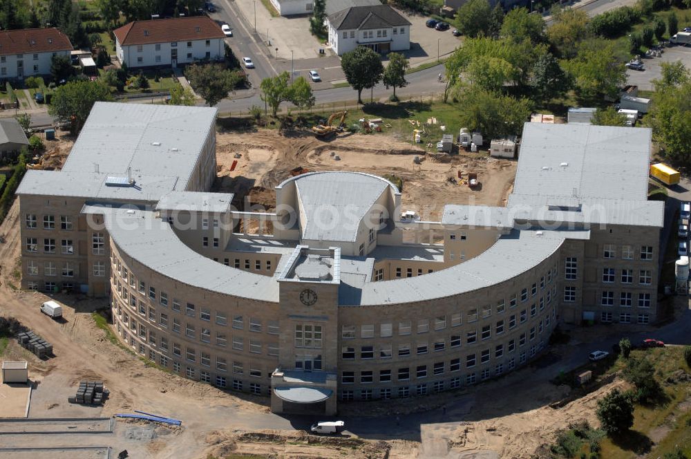 Bitterfeld-Wolfen from the bird's eye view: Blick auf die ehemalige Filmfabrik Wolfen (ORWO). Das Gebäude 041 wird derzeit für die Nutzung als Verwaltungszentrum Bitterfeld-Wolfen umgebaut. Das denkmalgeschützte Gebäude wird nach zehnjährigem Leerstand durch ortsansässige Firmen saniert. Bauherr ist die Wohnungs- und Baugesellschaft Wolfen mbH (WBG). Kontakt WBG: Tel. +49(0)3494 3661100, Email: info@wbgwolfen.de