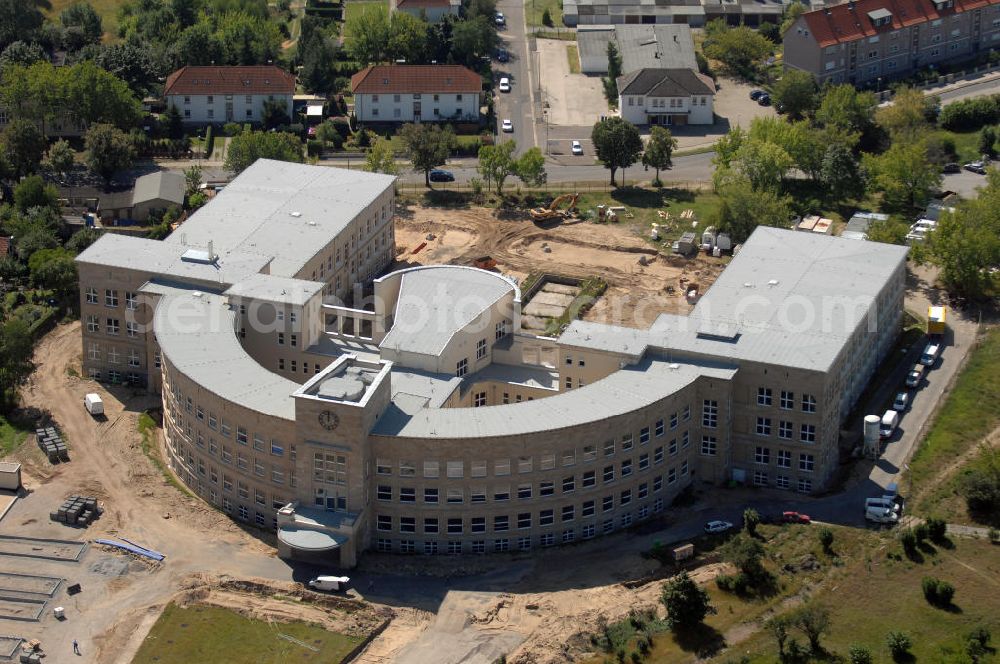 Aerial image Bitterfeld-Wolfen - Blick auf die ehemalige Filmfabrik Wolfen (ORWO). Das Gebäude 041 wird derzeit für die Nutzung als Verwaltungszentrum Bitterfeld-Wolfen umgebaut. Das denkmalgeschützte Gebäude wird nach zehnjährigem Leerstand durch ortsansässige Firmen saniert. Bauherr ist die Wohnungs- und Baugesellschaft Wolfen mbH (WBG). Kontakt WBG: Tel. +49(0)3494 3661100, Email: info@wbgwolfen.de