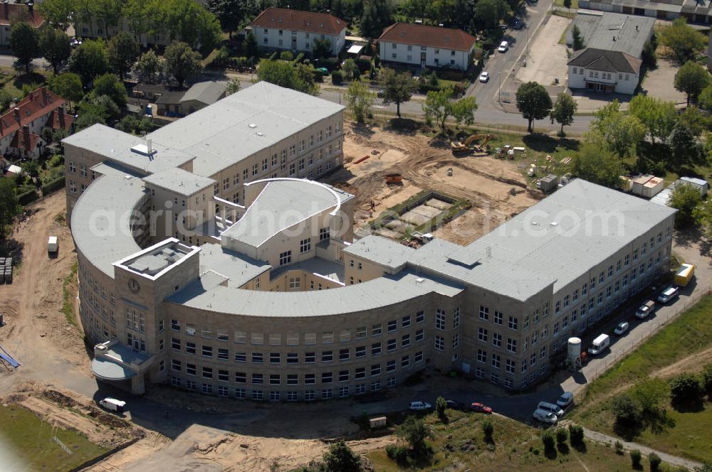 Bitterfeld-Wolfen from above - Blick auf die ehemalige Filmfabrik Wolfen (ORWO). Das Gebäude 041 wird derzeit für die Nutzung als Verwaltungszentrum Bitterfeld-Wolfen umgebaut. Das denkmalgeschützte Gebäude wird nach zehnjährigem Leerstand durch ortsansässige Firmen saniert. Bauherr ist die Wohnungs- und Baugesellschaft Wolfen mbH (WBG). Kontakt WBG: Tel. +49(0)3494 3661100, Email: info@wbgwolfen.de