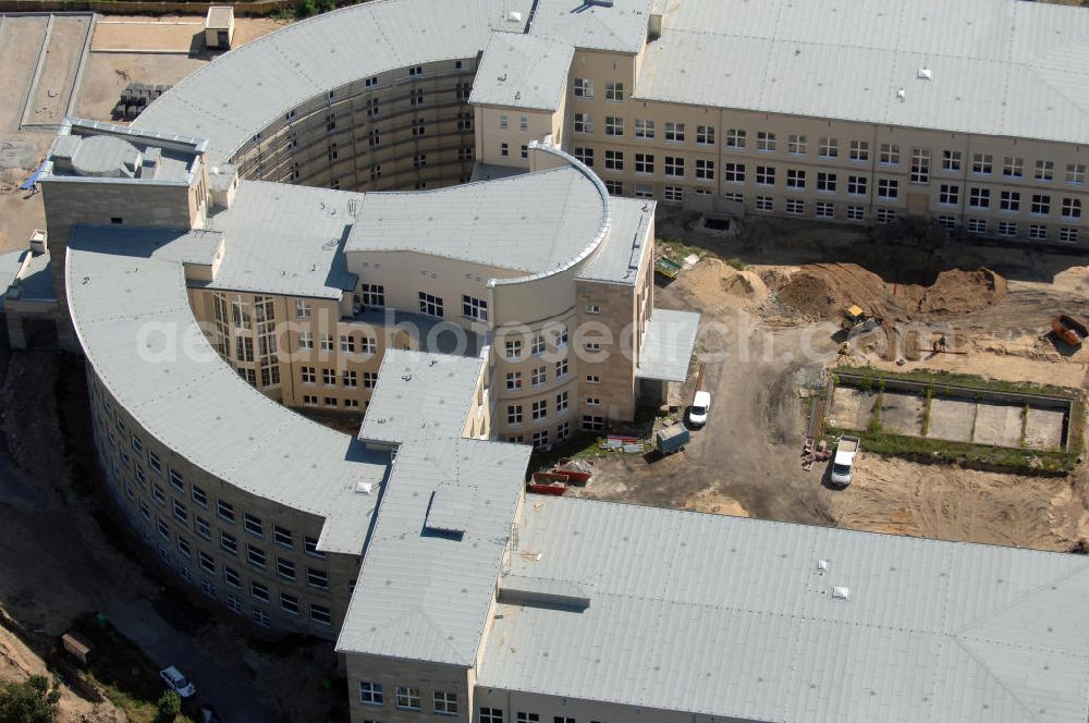 Bitterfeld-Wolfen from the bird's eye view: Blick auf die ehemalige Filmfabrik Wolfen (ORWO). Das Gebäude 041 wird derzeit für die Nutzung als Verwaltungszentrum Bitterfeld-Wolfen umgebaut. Das denkmalgeschützte Gebäude wird nach zehnjährigem Leerstand durch ortsansässige Firmen saniert. Bauherr ist die Wohnungs- und Baugesellschaft Wolfen mbH (WBG). Kontakt WBG: Tel. +49(0)3494 3661100, Email: info@wbgwolfen.de