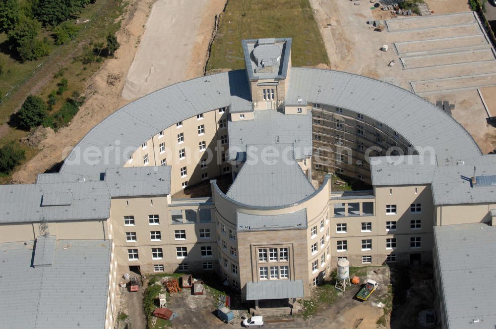 Bitterfeld-Wolfen from above - Blick auf die ehemalige Filmfabrik Wolfen (ORWO). Das Gebäude 041 wird derzeit für die Nutzung als Verwaltungszentrum Bitterfeld-Wolfen umgebaut. Das denkmalgeschützte Gebäude wird nach zehnjährigem Leerstand durch ortsansässige Firmen saniert. Bauherr ist die Wohnungs- und Baugesellschaft Wolfen mbH (WBG). Kontakt WBG: Tel. +49(0)3494 3661100, Email: info@wbgwolfen.de