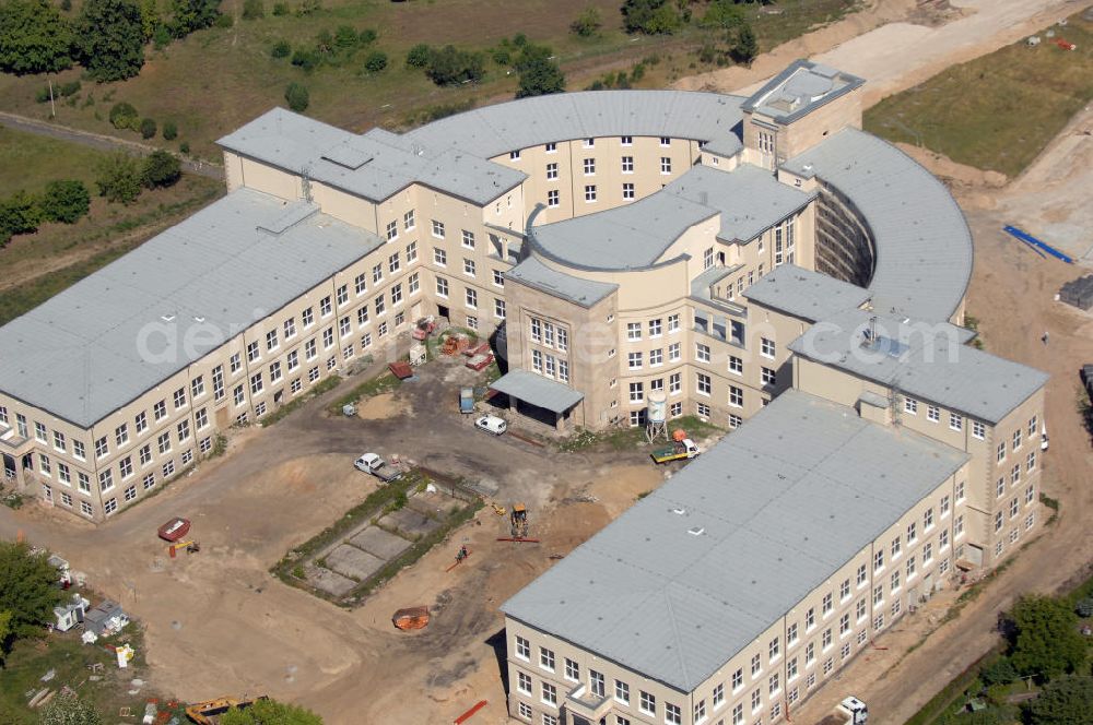 Bitterfeld-Wolfen from the bird's eye view: Blick auf die ehemalige Filmfabrik Wolfen (ORWO). Das Gebäude 041 wird derzeit für die Nutzung als Verwaltungszentrum Bitterfeld-Wolfen umgebaut. Das denkmalgeschützte Gebäude wird nach zehnjährigem Leerstand durch ortsansässige Firmen saniert. Bauherr ist die Wohnungs- und Baugesellschaft Wolfen mbH (WBG). Kontakt WBG: Tel. +49(0)3494 3661100, Email: info@wbgwolfen.de