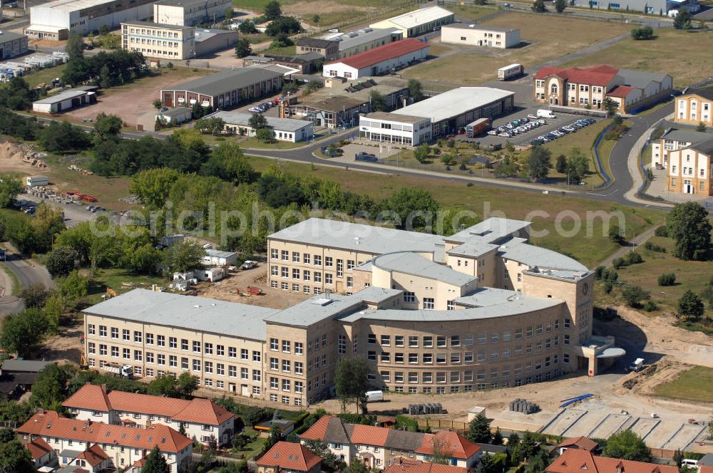 Aerial photograph Bitterfeld-Wolfen - Blick auf die ehemalige Filmfabrik Wolfen (ORWO). Das Gebäude 041 wird derzeit für die Nutzung als Verwaltungszentrum Bitterfeld-Wolfen umgebaut. Das denkmalgeschützte Gebäude wird nach zehnjährigem Leerstand durch ortsansässige Firmen saniert. Bauherr ist die Wohnungs- und Baugesellschaft Wolfen mbH (WBG). Kontakt WBG: Tel. +49(0)3494 3661100, Email: info@wbgwolfen.de