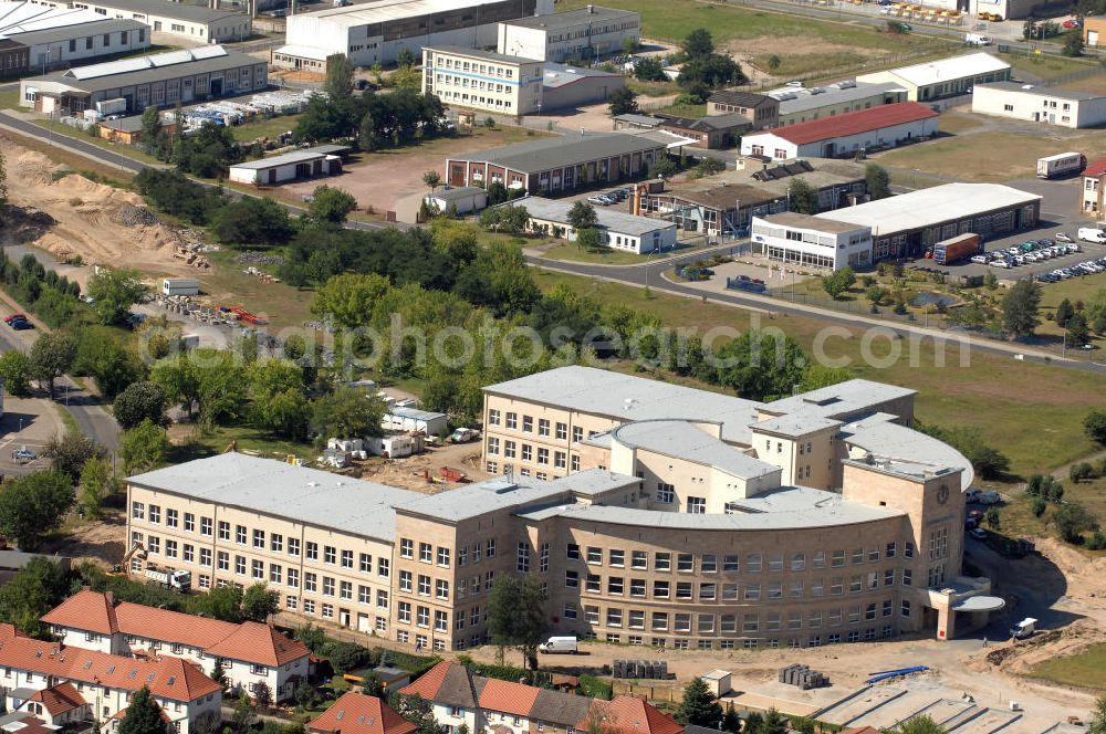 Bitterfeld-Wolfen from above - Blick auf die ehemalige Filmfabrik Wolfen (ORWO). Das Gebäude 041 wird derzeit für die Nutzung als Verwaltungszentrum Bitterfeld-Wolfen umgebaut. Das denkmalgeschützte Gebäude wird nach zehnjährigem Leerstand durch ortsansässige Firmen saniert. Bauherr ist die Wohnungs- und Baugesellschaft Wolfen mbH (WBG). Kontakt WBG: Tel. +49(0)3494 3661100, Email: info@wbgwolfen.de