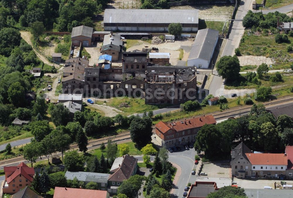 Aerial image Greußen - View of the ruins of the former building of the chocolate factory on the property on Schwarzburger Strasse and the railway station Greussen in Greussen in the state of Thuringia