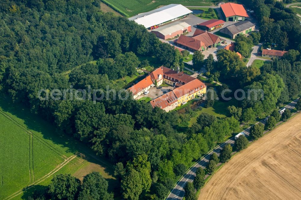 Kirchlengern from above - Former water castle and estate Oberbehme in Kirchlengern in the state of North Rhine-Westphalia. The historic compound and building complex with the courtyard and yellow front is located in the valley of the river Werre on federal road B239