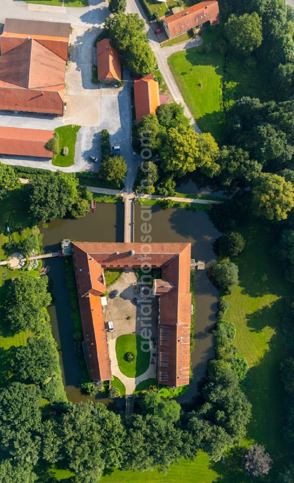 Aerial image Kirchlengern - Former water castle and estate Oberbehme in Kirchlengern in the state of North Rhine-Westphalia. The historic compound and building complex with the courtyard and yellow front is located in the valley of the river Werre on federal road B239