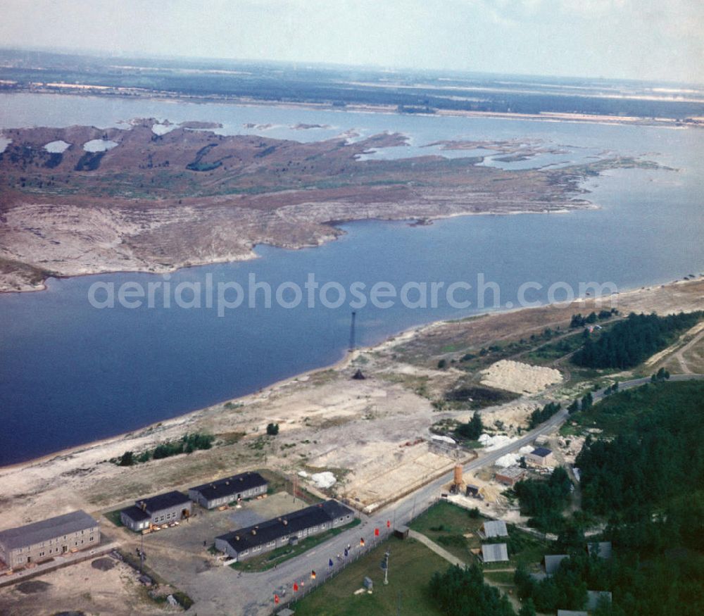 Senftenberg from the bird's eye view: Ehemaliger Braunkohletagebau Senftenberg zu DDR-Zeiten in Brandenburg. Der Senftenberger See, früher auch Speicherbecken Niemtsch, liegt im Lausitzer Seenland, einer künstlich geschaffenen Seenkette. Former brown coal opencast mining Senftenberg in GDR times.