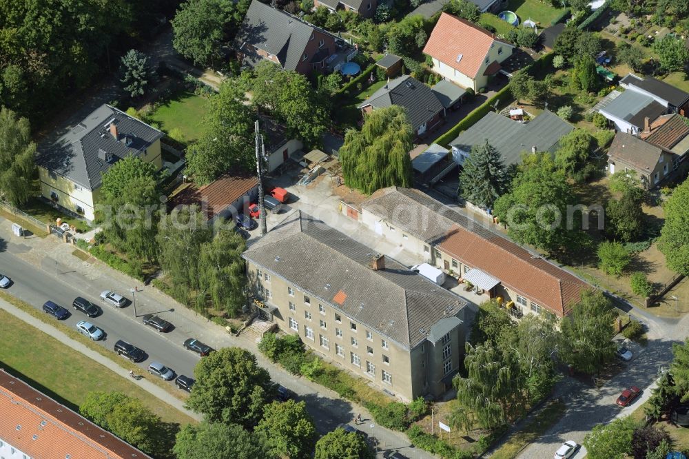 Aerial image Berlin - Historic post office in the Biesdorf part of the district of Marzahn-Hellersdorf in Berlin in Germany. The historic post office is located amidst residential buildings on Oberfeldstrasse. An antenna of Deutsche Funkturm is located on site as well