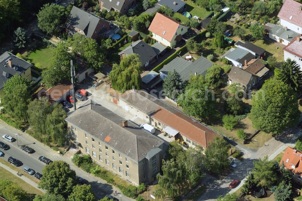 Aerial photograph Berlin - Historic post office in the Biesdorf part of the district of Marzahn-Hellersdorf in Berlin in Germany. The historic post office is located amidst residential buildings on Oberfeldstrasse. An antenna of Deutsche Funkturm is located on site as well