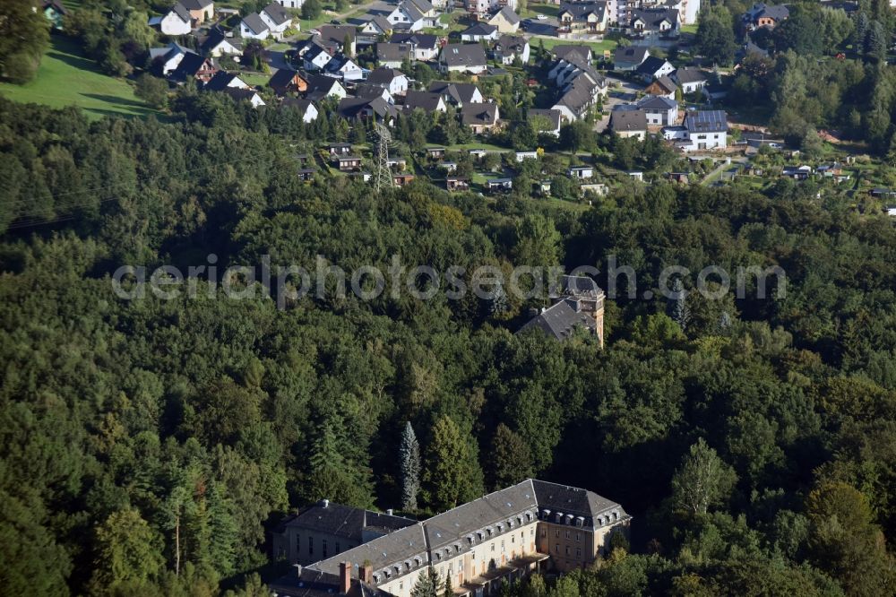 Aerial image Bad Schlema - Former sanatorium in a forest in Bad Schlema in the state of Saxony. The sanatorium was opened in the 1950s by SDAG Wismut and is empty today