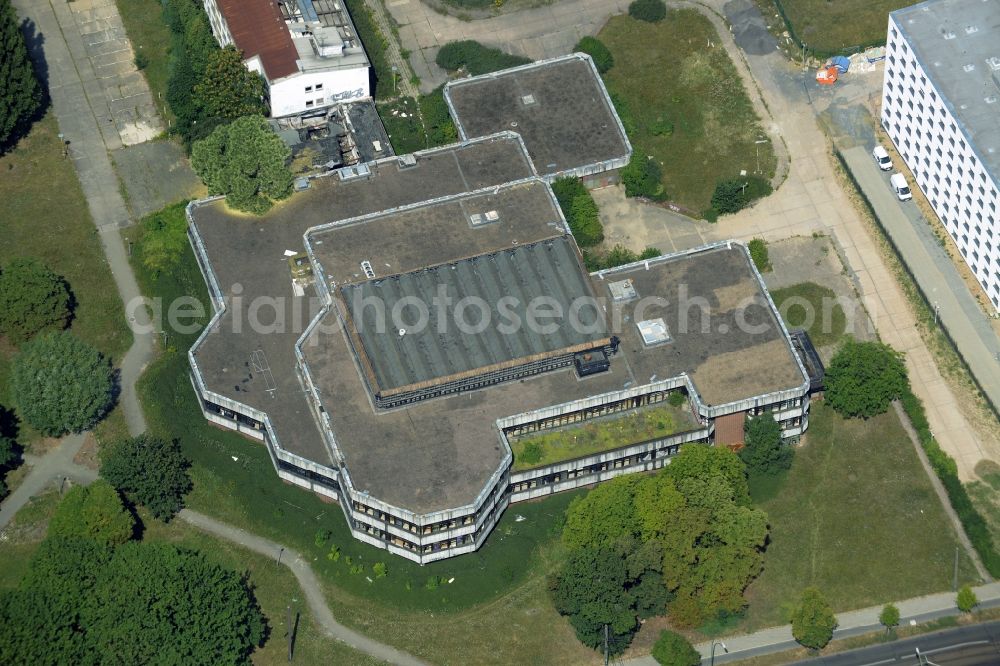 Berlin from above - Former sports hotel on the Southern end of the Sportforum Hohenschoenhausen in the Alt-Hohenschoenhausen part of the district of Lichtenberg in Berlin in Germany. The second largest sports and training facilities of Berlin includes the former - decaying - hotel