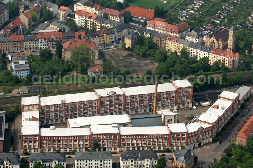 Dresden from the bird's eye view: Building complex of the former packaging supplies plant in the district Pieschen at the street Riesaer Strasse in Saxony. The partially rebuilt and renovated buildings are now used as an office building