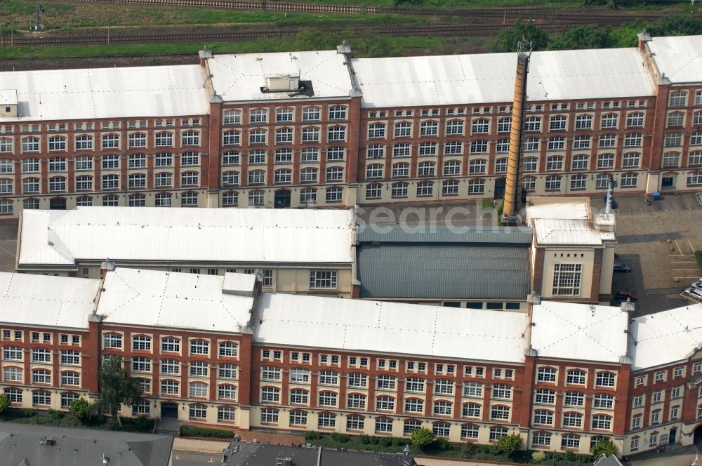 Aerial photograph Dresden - Building complex of the former packaging supplies plant in the district Pieschen at the street Riesaer Strasse in Saxony. The partially rebuilt and renovated buildings are now used as an office building