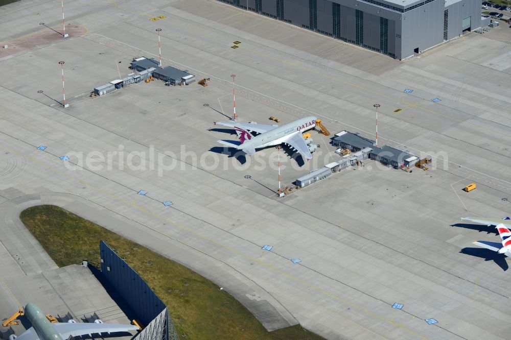 Aerial image Hamburg - Airbus A380-800 of Qatar Airways on the works facilities and area of the airport Finkenwerder in Hamburg in Germany