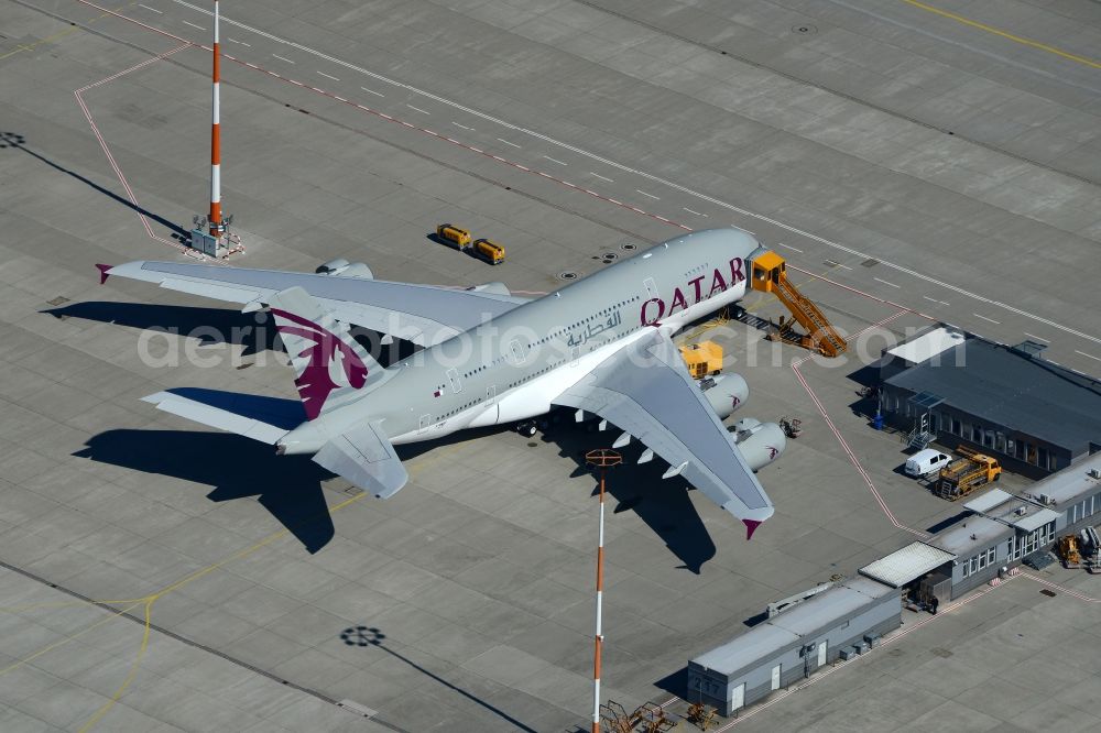 Aerial photograph Hamburg - Airbus A380-800 of Qatar Airways on the works facilities and area of the airport Finkenwerder in Hamburg in Germany