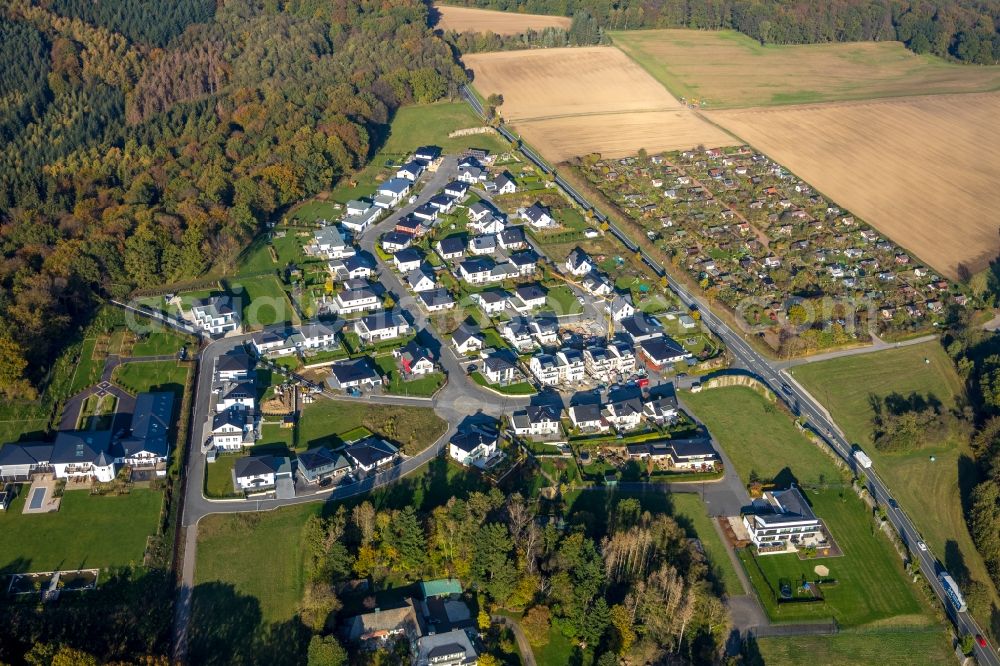 Arnsberg from the bird's eye view: Construction site for the new construction of a detached house in a family house - settlement a??Dollberga?? Zum Dollberg in the district Neheim in Arnsberg in the state North Rhine-Westphalia, Germany