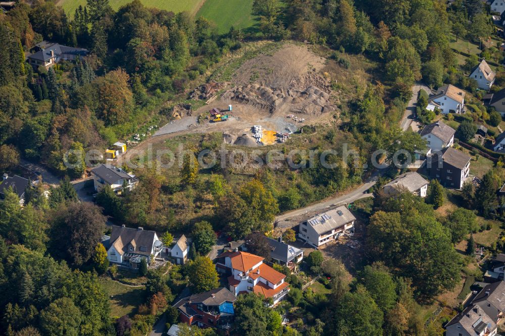 Aerial image Meschede - Construction site for the new construction of a detached house in a family house - settlement along the on street Unterm Hasenfeld in Meschede at Sauerland in the state North Rhine-Westphalia, Germany