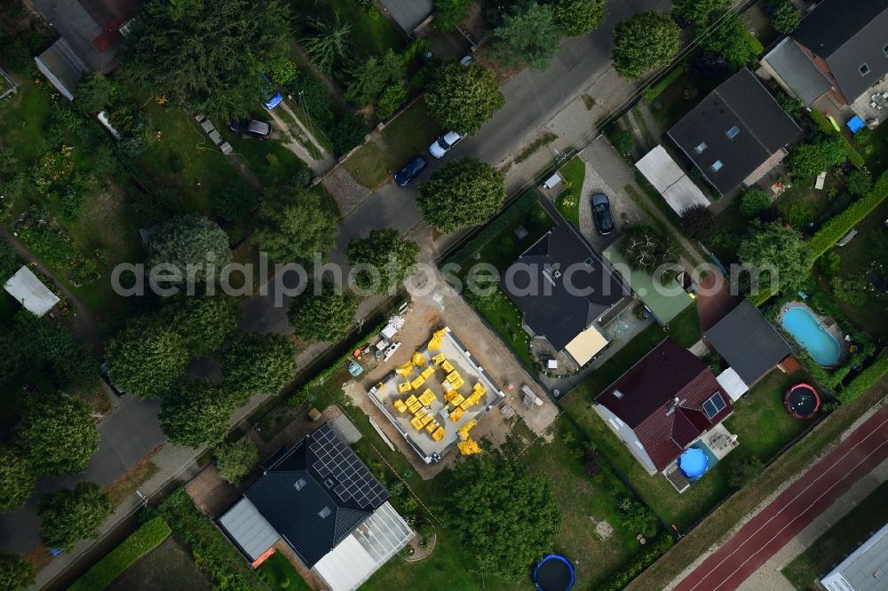 Berlin from above - Construction site for the new construction of a detached house in a family house - settlement along the Bergedorfer Strasse in the district Kaulsdorf in Berlin, Germany