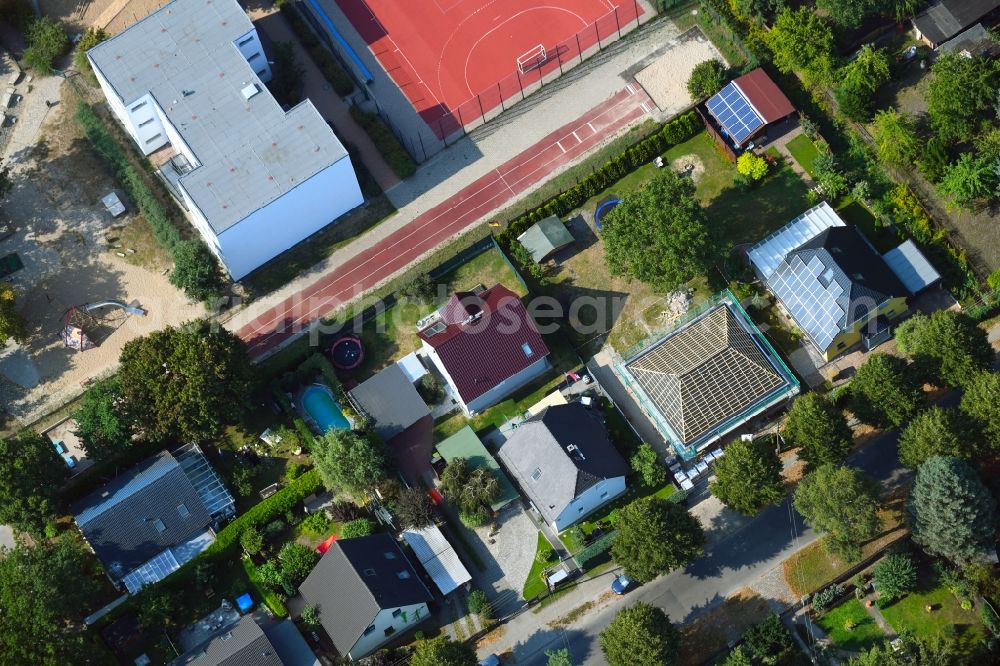 Berlin from above - Construction site for the new construction of a detached house in a family house - settlement along the Bergedorfer Strasse in the district Kaulsdorf in Berlin, Germany