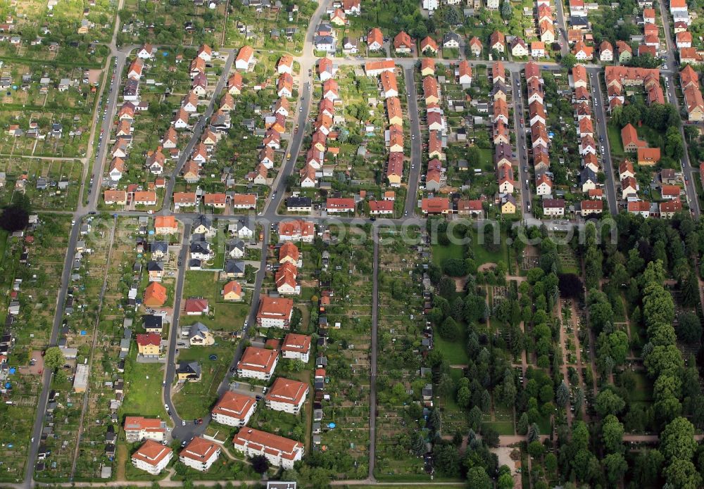 Aerial image Eisenach - Taken Pray of allotments located between the street Am Schaefersborn and Elsa Brandstroem Avenue in Eisenach in Thuringia a residential estate with some apartment buildings. In the foreground the central cemetery can be seen at Wartenberg