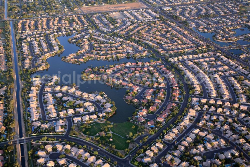 Aerial image Avondale - Residential development in the greater Phoenix area in Avondale, Arizona in USA. Dense development, close neighborhood, but also generous development with lakes and countryside. An oasis in the desert
