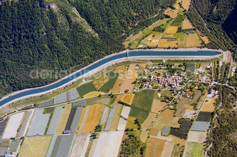 Rochebrune from above - Fields and entrance to the underground canal in Rochebrune in Provence-Alpes-Cote d'Azur, France