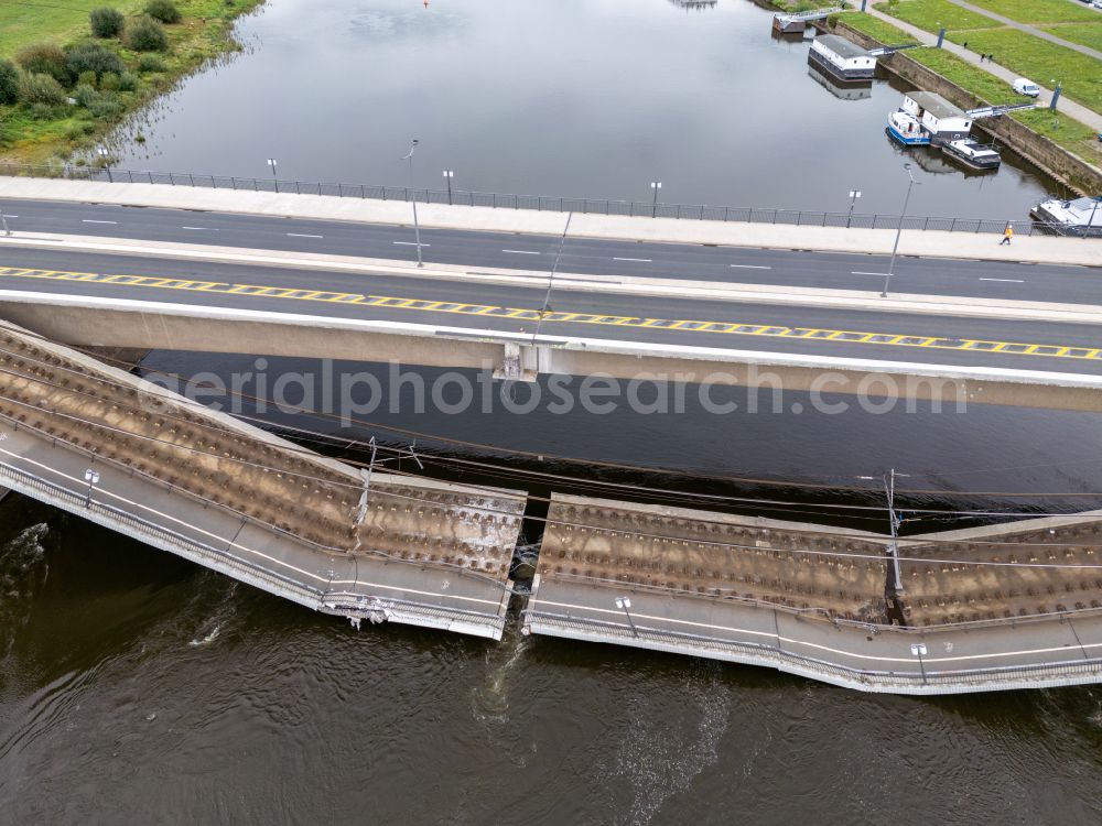 Dresden from the bird's eye view: Concrete segments of the collapsed river bridge structure for crossing the Elbe Carolabruecke on the street Carolabruecke in Dresden in the federal state of Saxony, Germany, have fallen down into the riverbed of the Elbe