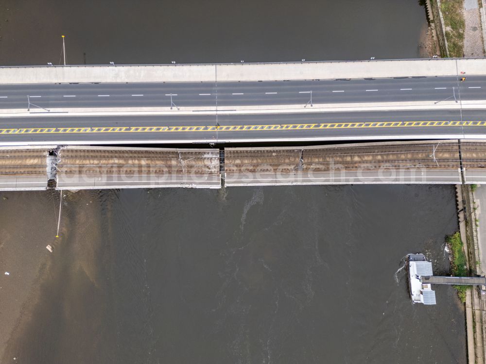 Dresden from the bird's eye view: Concrete segments of the collapsed river bridge structure for crossing the Elbe Carolabruecke on the street Carolabruecke in Dresden in the federal state of Saxony, Germany, have fallen down into the riverbed of the Elbe