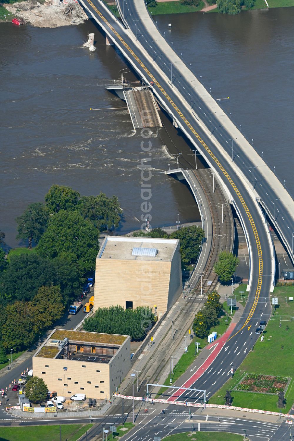 Aerial image Dresden - Concrete segments of the collapsed river bridge structure for crossing the Elbe Carolabruecke on the street Carolabruecke in Dresden in the federal state of Saxony, Germany, have fallen down into the riverbed of the Elbe