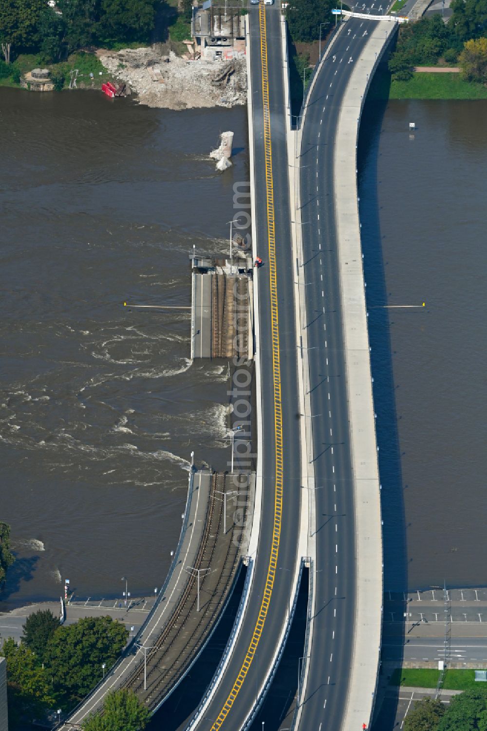 Dresden from above - Concrete segments of the collapsed river bridge structure for crossing the Elbe Carolabruecke on the street Carolabruecke in Dresden in the federal state of Saxony, Germany, have fallen down into the riverbed of the Elbe