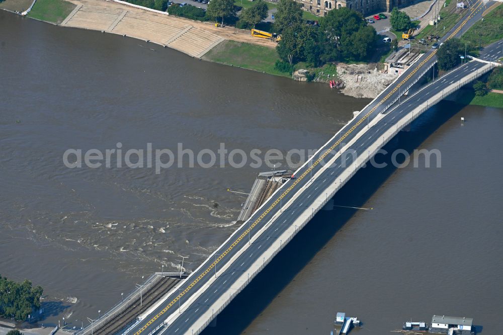 Aerial image Dresden - Concrete segments of the collapsed river bridge structure for crossing the Elbe Carolabruecke on the street Carolabruecke in Dresden in the federal state of Saxony, Germany, have fallen down into the riverbed of the Elbe