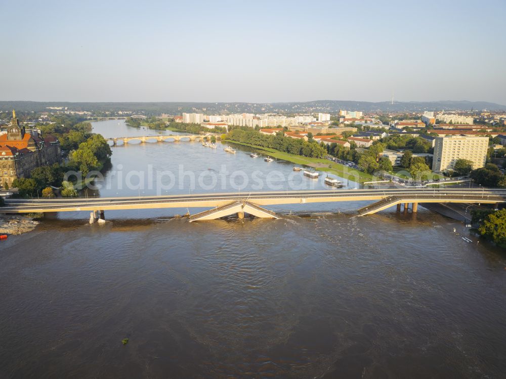 Aerial image Dresden - Concrete segments of the collapsed river bridge structure for crossing the Elbe Carolabruecke on the street Carolabruecke in Dresden in the federal state of Saxony, Germany, have fallen down into the riverbed of the Elbe