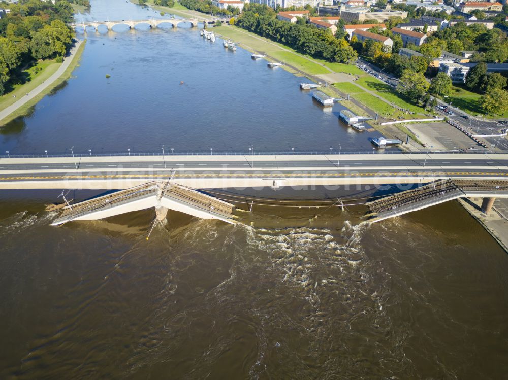 Aerial image Dresden - Concrete segments of the collapsed river bridge structure for crossing the Elbe Carolabruecke on the street Carolabruecke in Dresden in the federal state of Saxony, Germany, have fallen down into the riverbed of the Elbe