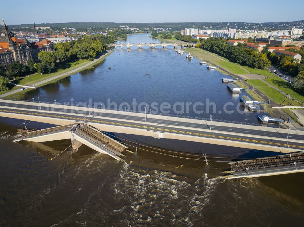 Dresden from the bird's eye view: Concrete segments of the collapsed river bridge structure for crossing the Elbe Carolabruecke on the street Carolabruecke in Dresden in the federal state of Saxony, Germany, have fallen down into the riverbed of the Elbe