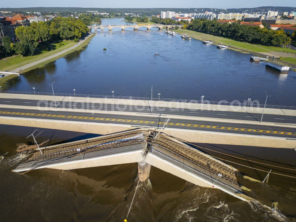 Aerial image Dresden - Concrete segments of the collapsed river bridge structure for crossing the Elbe Carolabruecke on the street Carolabruecke in Dresden in the federal state of Saxony, Germany, have fallen down into the riverbed of the Elbe